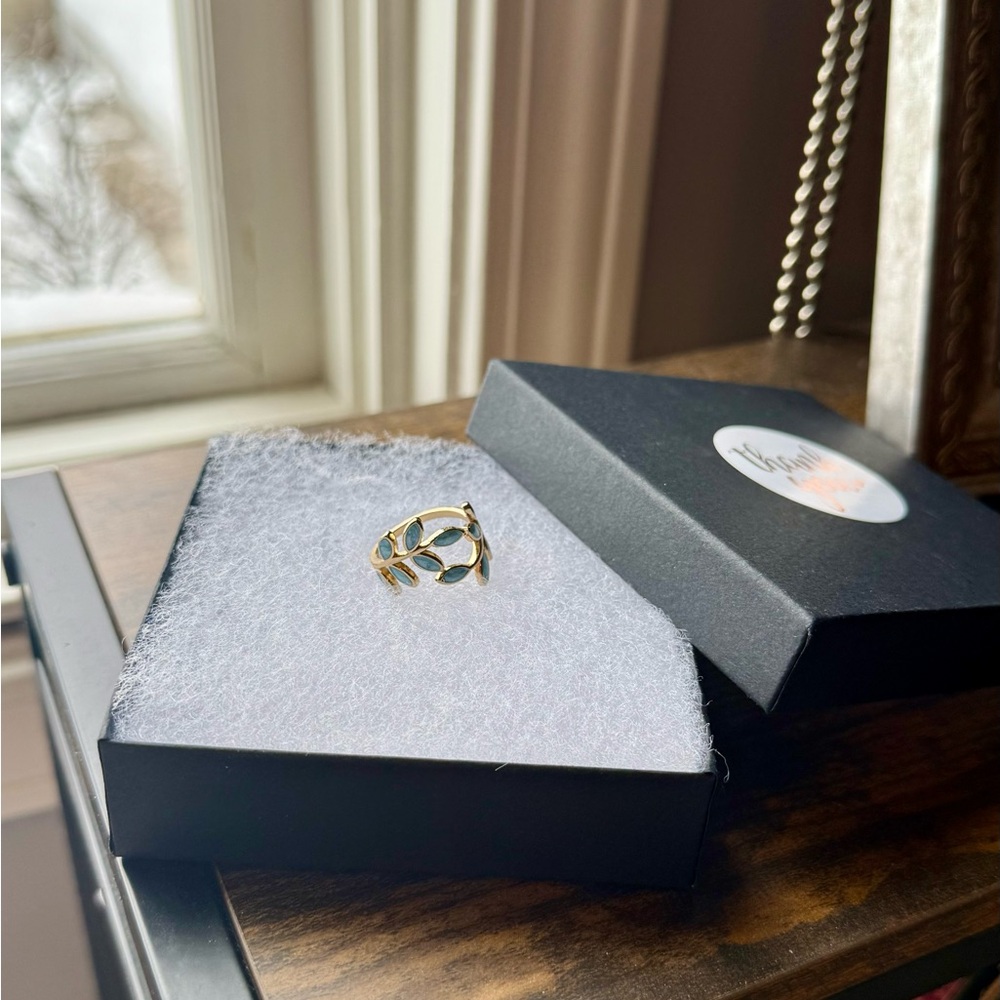 Adjustable Gold Leaf Ring with light blue stone inset